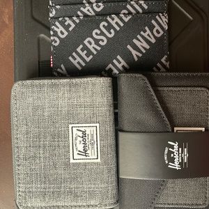 Selling 3 herschel wallets brand new .